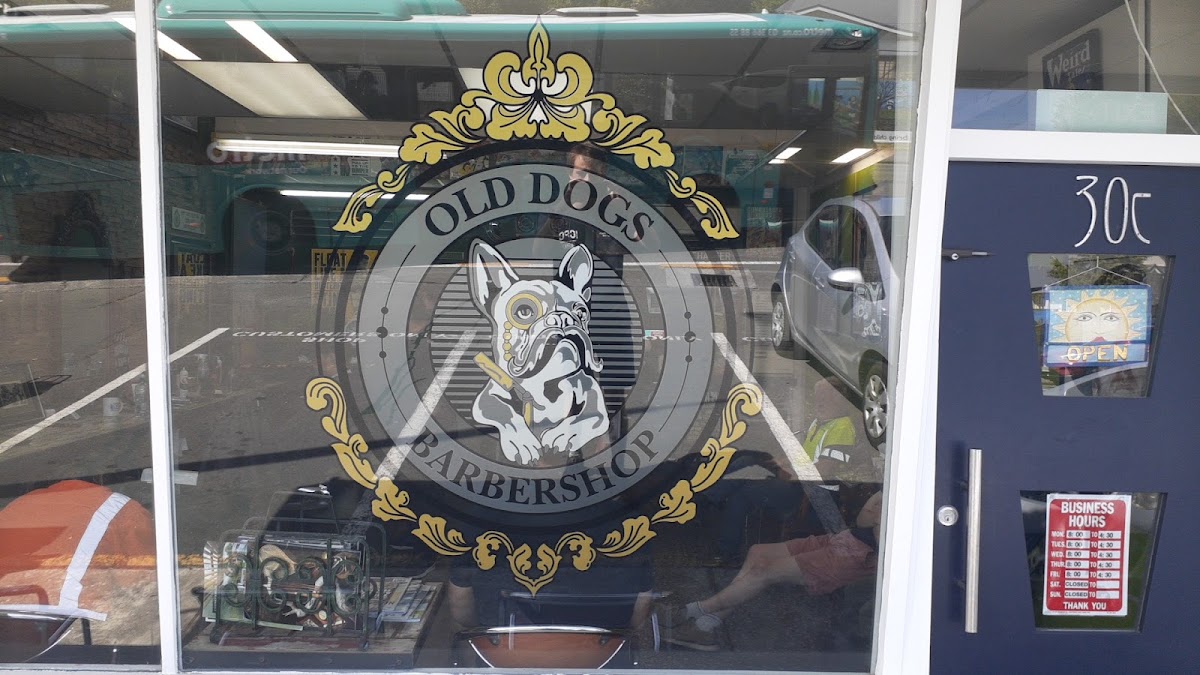 The Old Dogs Barbershop bulldog window decal on Yaldhurst Road